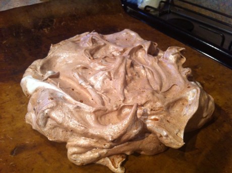 Glossy chocolate pavlova on its way to the oven