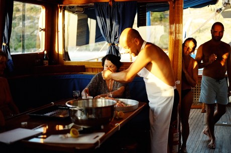 Theodore Kyriakou demonstrates authentic Greek cooking on board the Tussock cruise