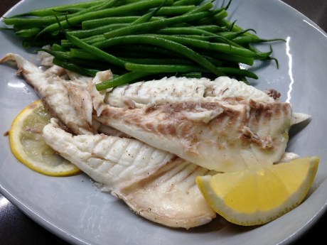The buttery beans and lemony fish just finish this dish